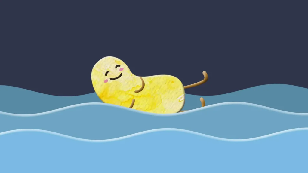 A smiling yellow cartoon character floats peacefully on gentle blue waves.